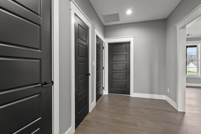 hall featuring dark wood-type flooring