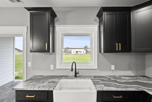 kitchen featuring plenty of natural light and sink