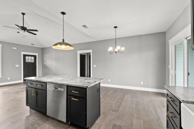 kitchen with pendant lighting, dishwasher, a center island, dark hardwood / wood-style floors, and lofted ceiling