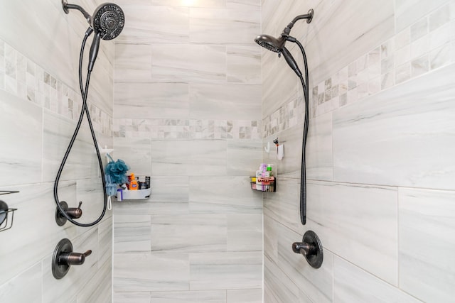 bathroom with a tile shower