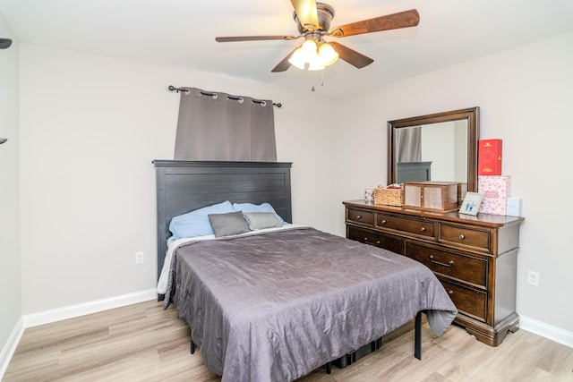 bedroom featuring ceiling fan and light hardwood / wood-style flooring