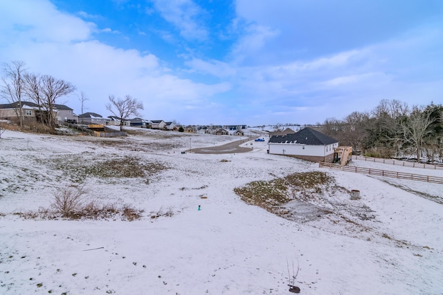 view of yard layered in snow