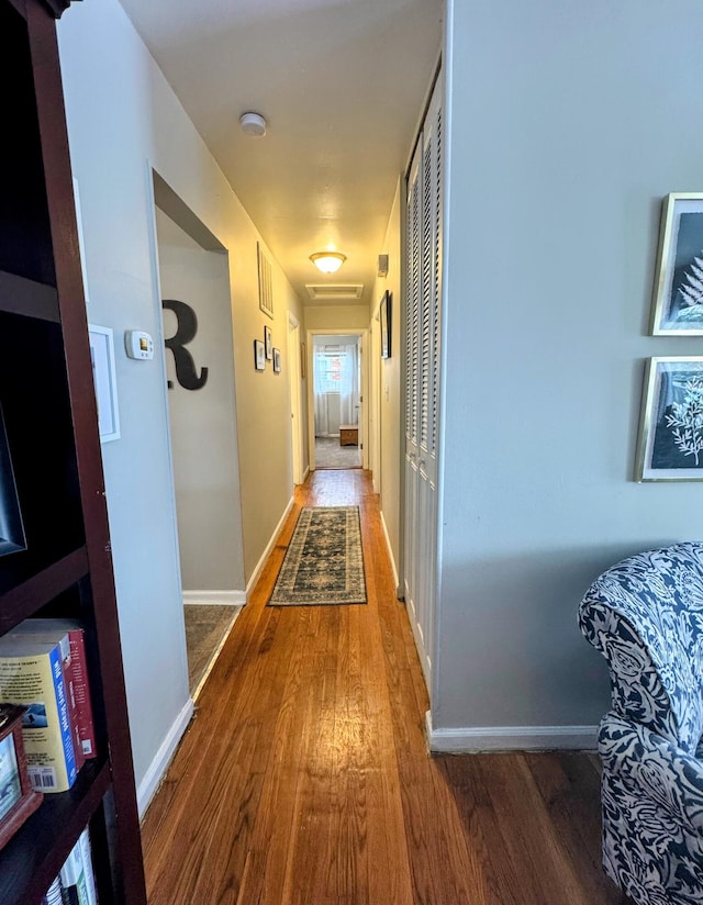 hall with wood-type flooring