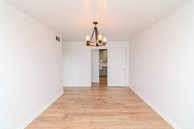 unfurnished bedroom with connected bathroom, a closet, and dark wood-type flooring