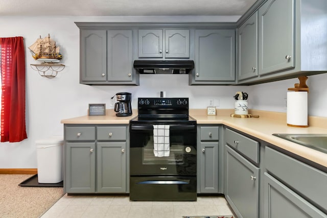 kitchen featuring gray cabinets, sink, black electric range oven, and light tile patterned floors