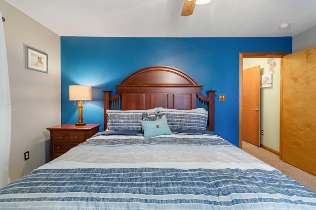 carpeted bedroom with ceiling fan