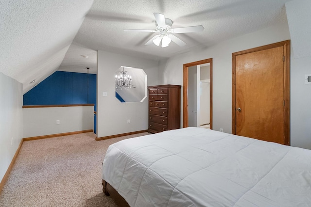 bedroom featuring carpet, a textured ceiling, ceiling fan, and lofted ceiling