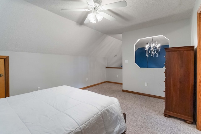 bedroom featuring a textured ceiling, ceiling fan with notable chandelier, lofted ceiling, and light carpet