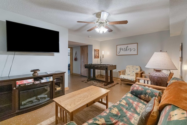 living room featuring a textured ceiling and ceiling fan