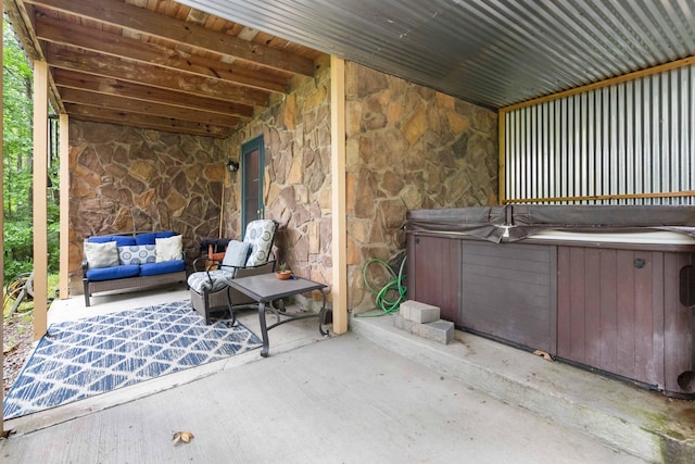 view of patio with a hot tub