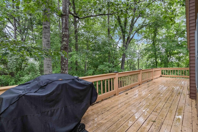 wooden terrace featuring grilling area