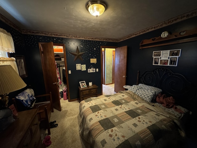 carpeted bedroom with a textured ceiling