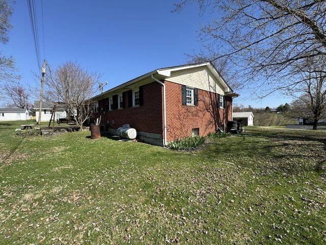 view of property exterior featuring a lawn