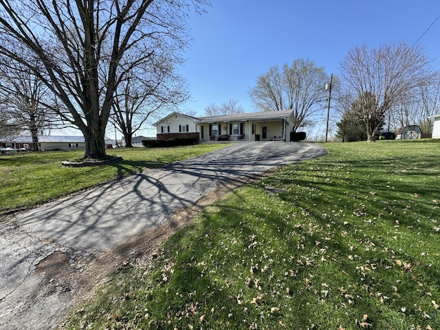 ranch-style house with a front lawn