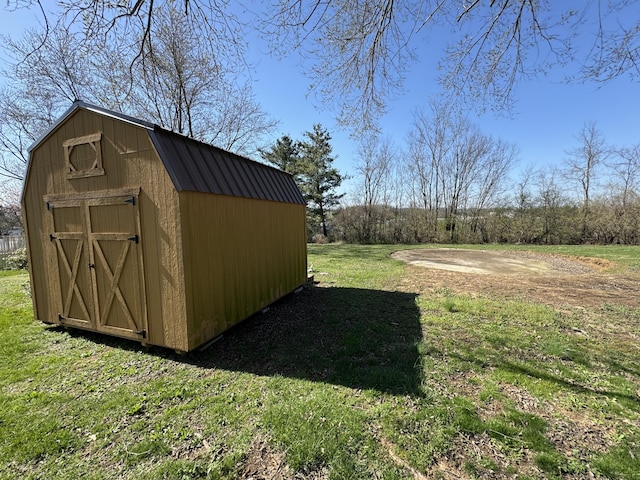 view of outbuilding with a yard