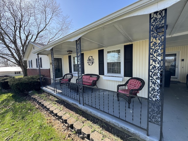 entrance to property featuring covered porch