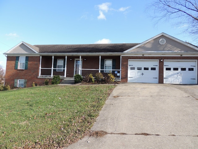 ranch-style house featuring a front lawn, covered porch, and a garage