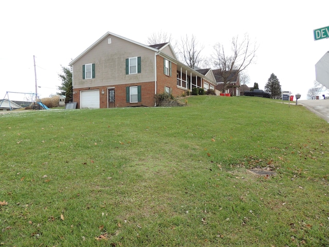 view of yard featuring a garage