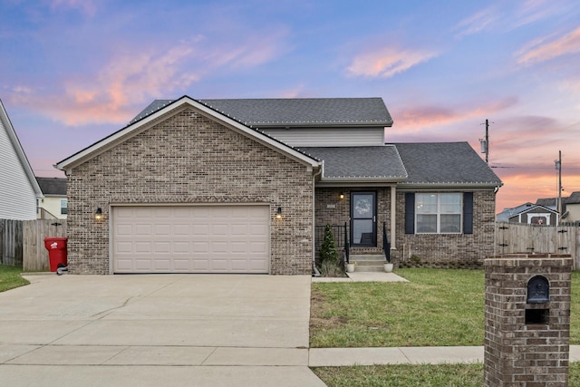 front facade featuring a yard and a garage