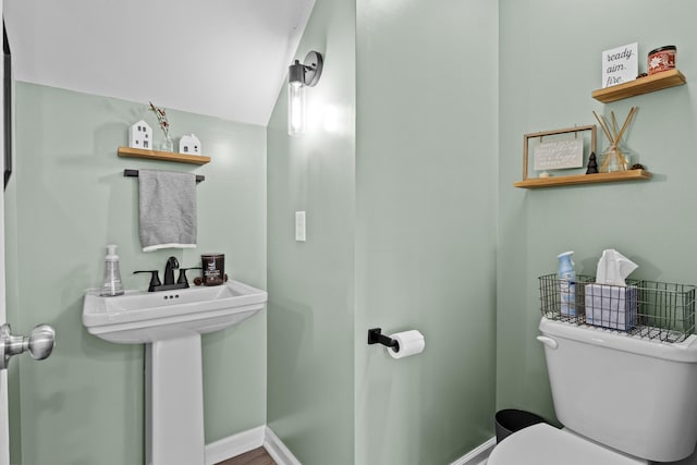 bathroom featuring sink and toilet