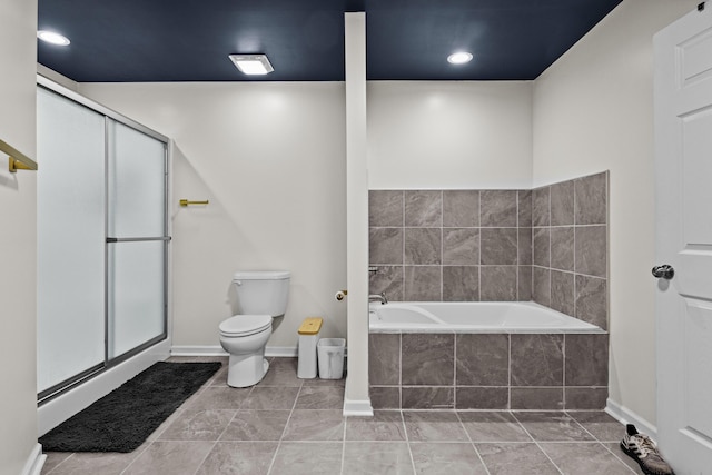 bathroom with tile patterned floors, toilet, and independent shower and bath