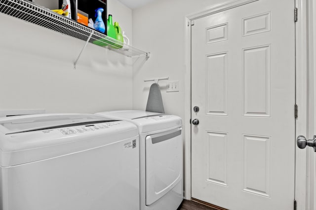 clothes washing area with washer and dryer