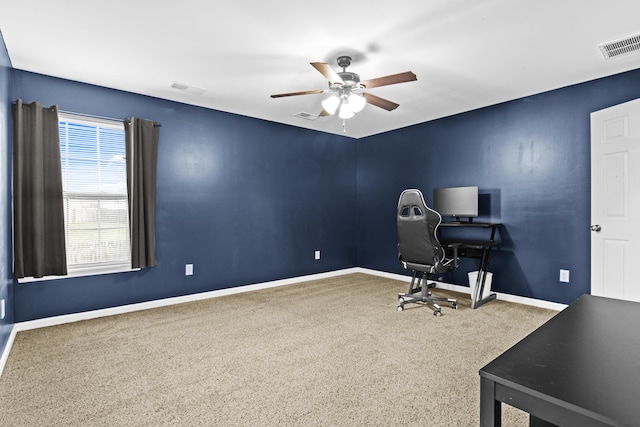 office area with ceiling fan and carpet