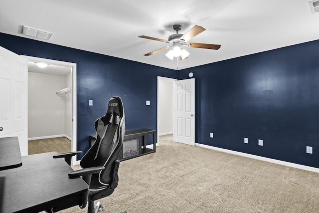 home office featuring carpet and ceiling fan