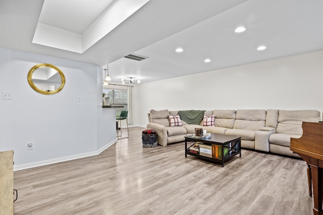 living room with light hardwood / wood-style floors