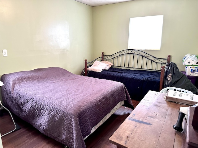 bedroom featuring dark hardwood / wood-style floors