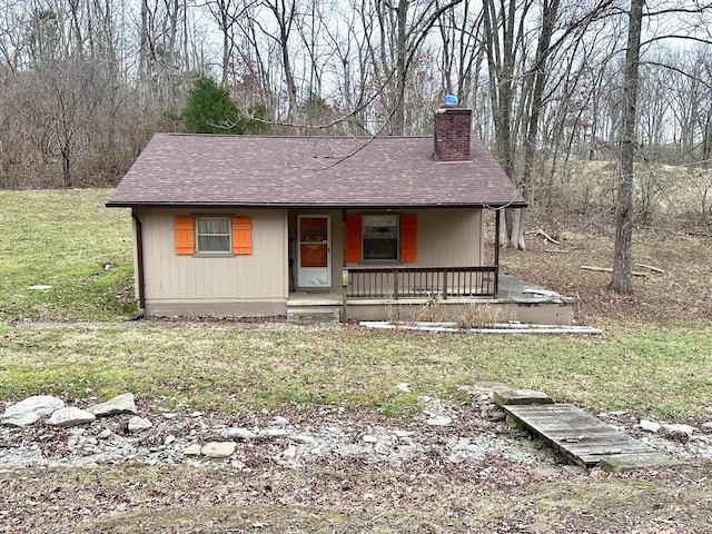 view of front of house featuring a porch and a front lawn