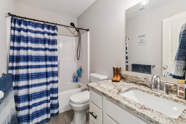 full bathroom featuring tile patterned flooring, vanity, toilet, and shower / bath combo with shower curtain