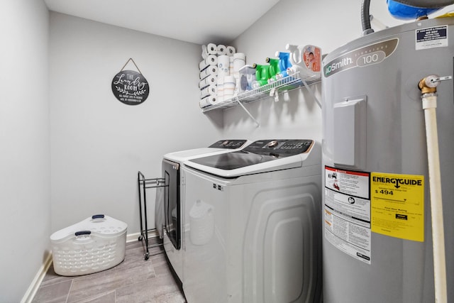 washroom with separate washer and dryer and water heater