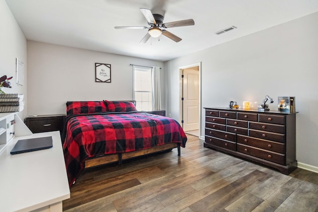 bedroom with ceiling fan and dark hardwood / wood-style floors