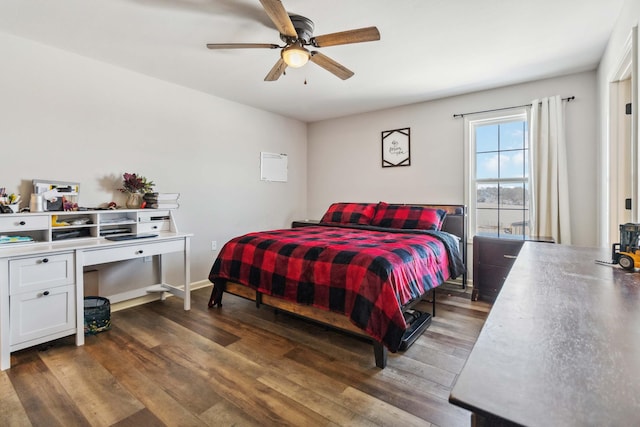 bedroom featuring ceiling fan and dark wood-type flooring