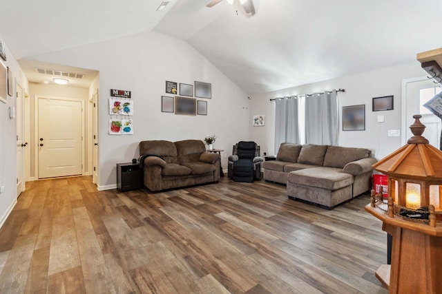 living room featuring hardwood / wood-style floors, ceiling fan, and lofted ceiling