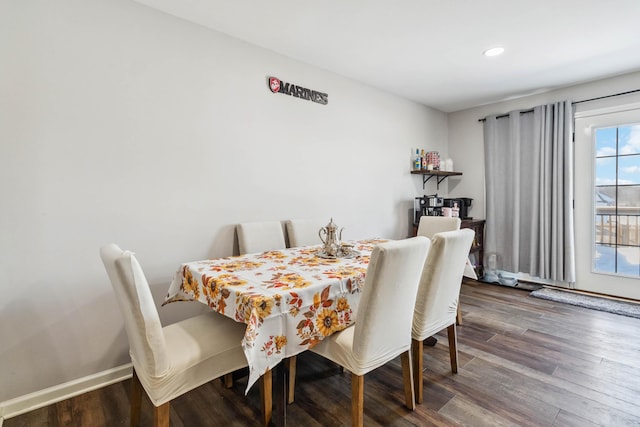 dining space featuring dark hardwood / wood-style floors