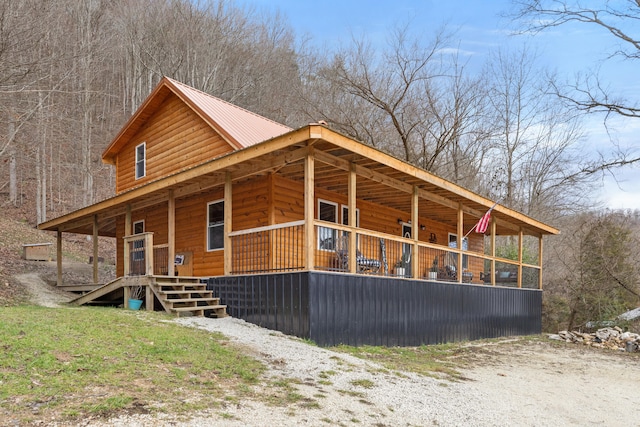 view of property exterior featuring covered porch