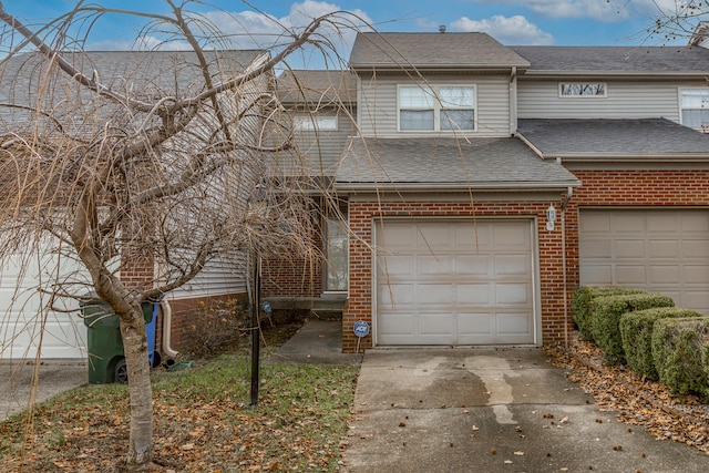 townhome / multi-family property with a garage