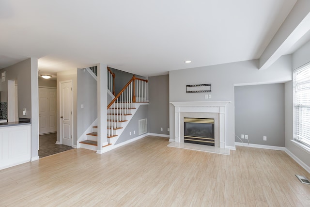 unfurnished living room featuring light wood-type flooring