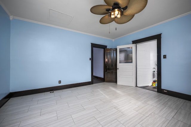 spare room featuring baseboards, ornamental molding, and ceiling fan