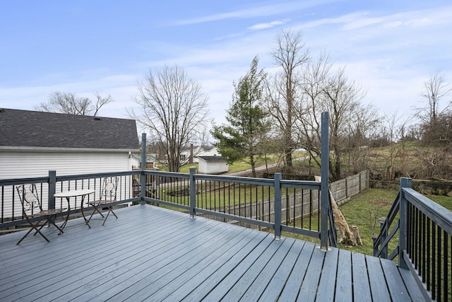 deck featuring a yard and fence