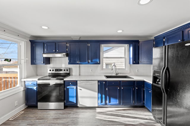 kitchen with sink, blue cabinets, white dishwasher, stainless steel electric stove, and black fridge with ice dispenser