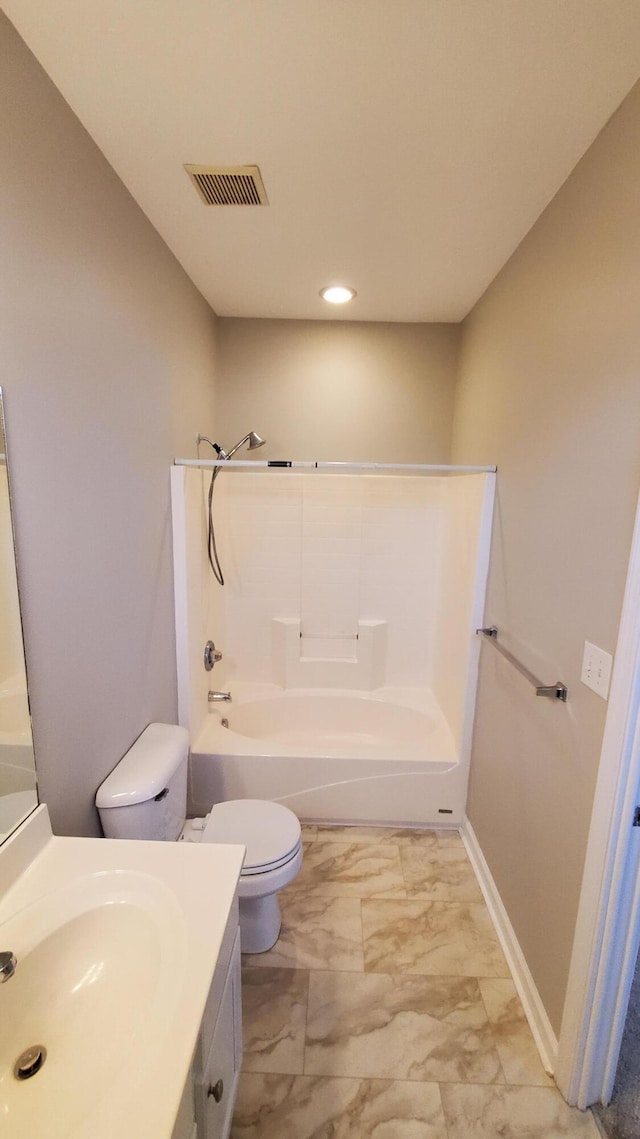 bathroom with visible vents, toilet, bathing tub / shower combination, marble finish floor, and vanity