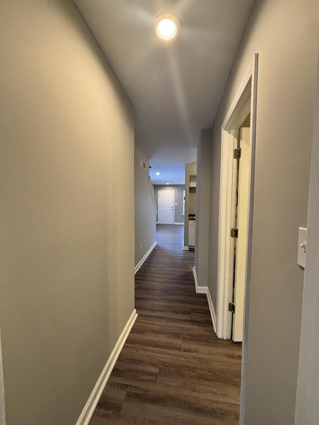 corridor featuring dark hardwood / wood-style flooring