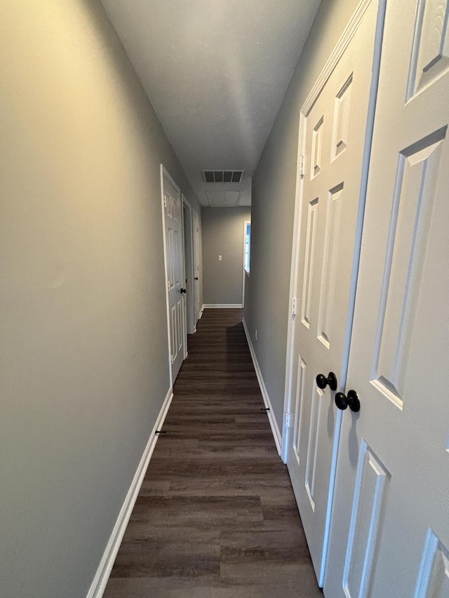 hall featuring dark wood-type flooring