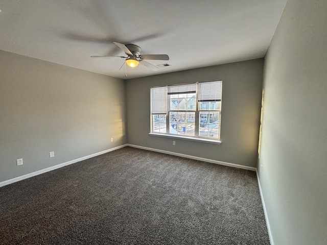 carpeted empty room featuring ceiling fan