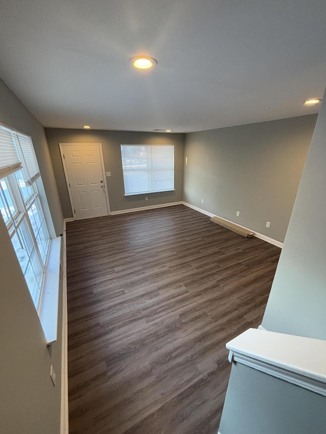 interior space with dark hardwood / wood-style floors