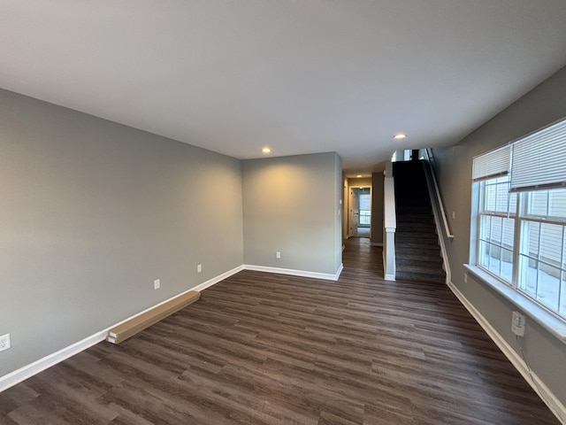 unfurnished room featuring dark hardwood / wood-style flooring