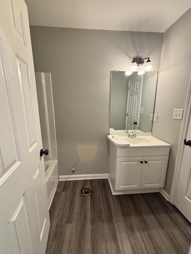 bathroom with vanity and hardwood / wood-style floors